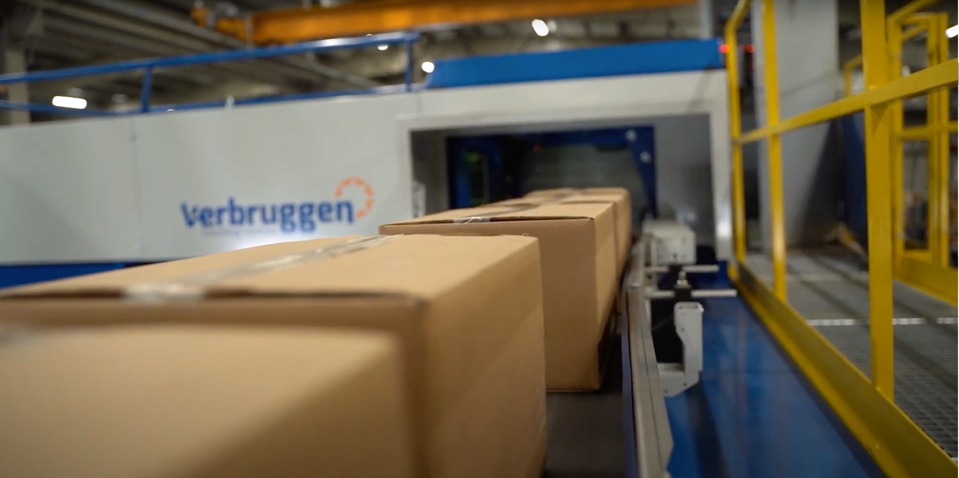 Conveyor belt transporting boxes of food